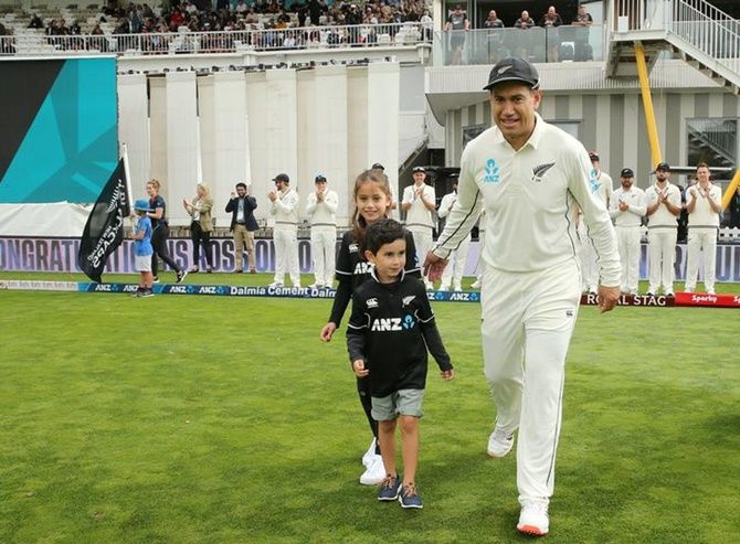 New Zealand's Ross Taylor walks out to Basin Reserve ground in Wellington with his children before the first Test against India on Friday.