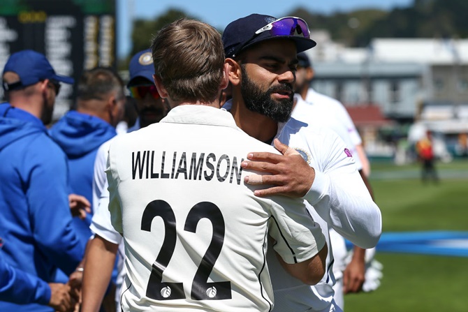 Captains Virat Kohli and Kane Williamson embrace at the conclusion of the first Test between New Zealand and India, at Basin Reserve in Wellington, on Monday. 