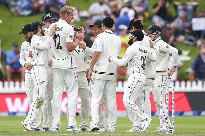 New Zealand's debutant pacer Kyle Jamieson celebrates with teammates after dismissing India's captain Virat Kohli during Day 1 of the first Test, at Basin Reserve in Wellington. 