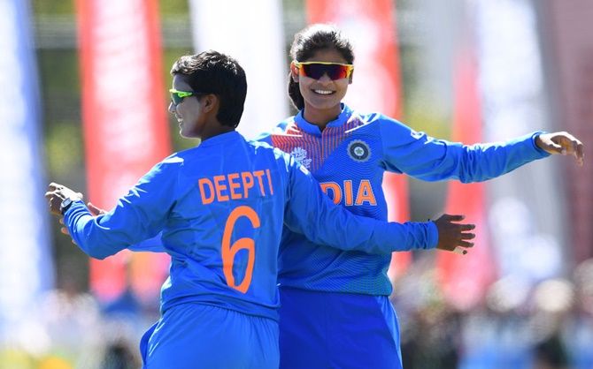 India's Radha Yadav is congratulated by Deepti Sharma after getting the wicket of Chamari Atapattu