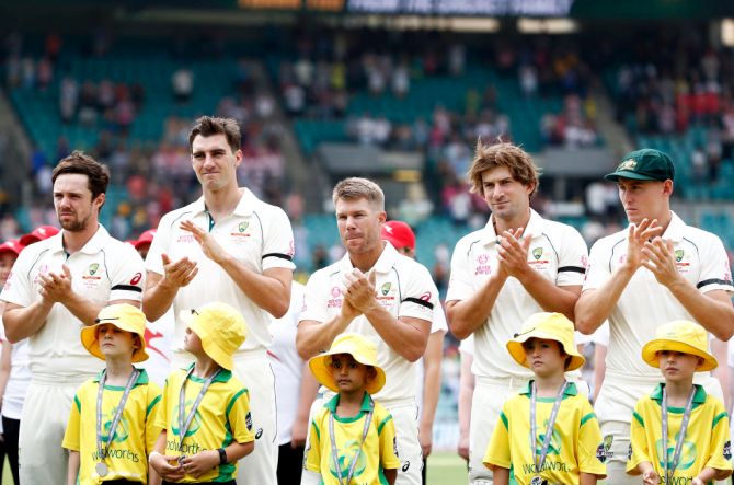 Australian cricketers Travis Head, Pat Cummins, David Warner, Joe Burns and Marnus Labuschagne applaud the firefighters for their selfless work in controlling the bushfires