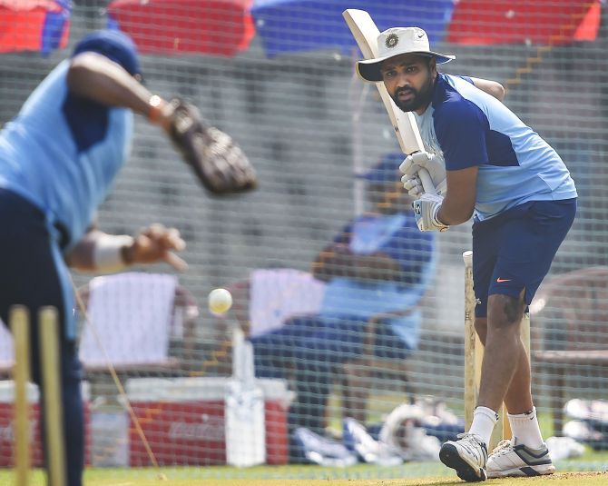 India's Rohit Sharma bats in the nets during a training session on Sunday, ahead of the first one day international cricket match against Australia, at Wankhede Stadium in Mumbai
