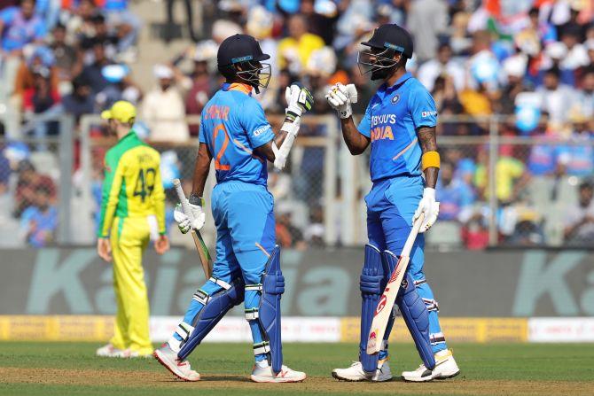 Shikhar Dhanwan and K L Rahul celebrate a boundary