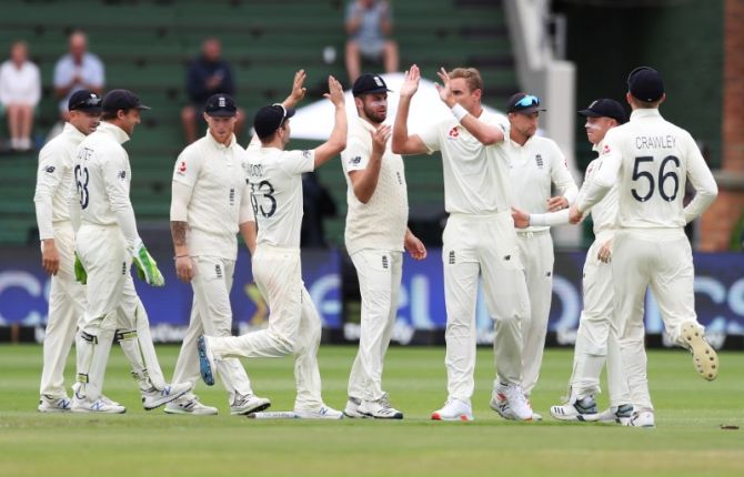 England's Stuart Broad celebrates with teammates on dismissing South Africa's Vernon Philander