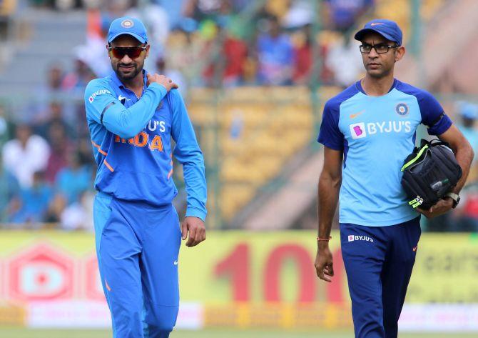 Shikhar Dhawan India walks back to the pavalion after getting injured during the 3rd ODI against Australia at the M Chinnaswamy Stadium in Bengaluru on Sunday