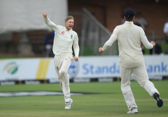 England's Joe Root celebrates taking the wicket of South Africa's Pieter Malan