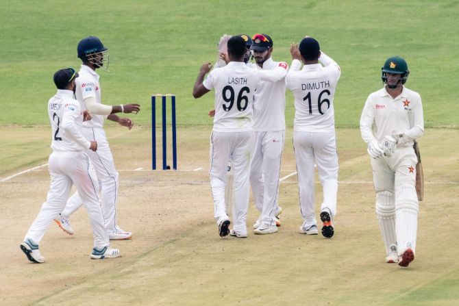 Sri Lanka players celebrate on dismissing a Zimbabwe batsman