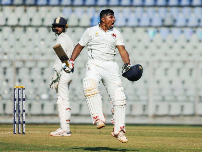 Mumbai's Sarfaraz Khan celebrates after scoring his century on the third day of the Ranji Trophy match against Uttar Pradesh at Wankhede Stadium in Mumbai on Tuesday