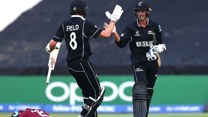 Kristian Clarke celebrates hitting the winning runs with Joseph Field as New Zealand defeat the West Indies in the ICC Under-19 World Super League Cup quarter-final