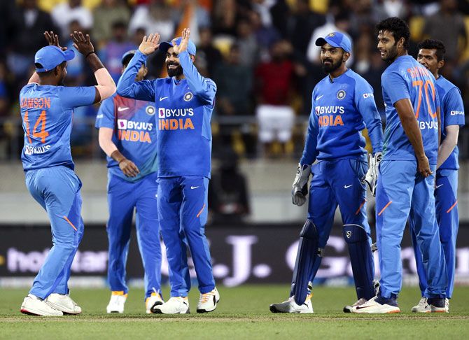 India's players celebrate the dismissal of Colin Munro during the fourth T20I against New Zealand in Wellington on Friday.