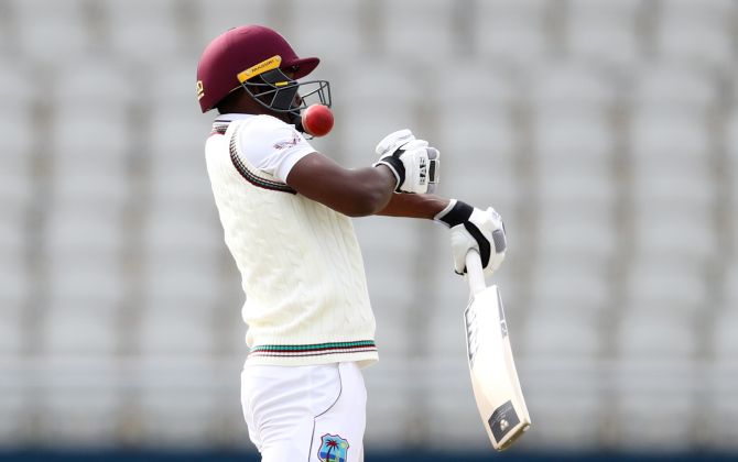 Sharmarh Brooks tries to fend off a Stuart Broad bouncer