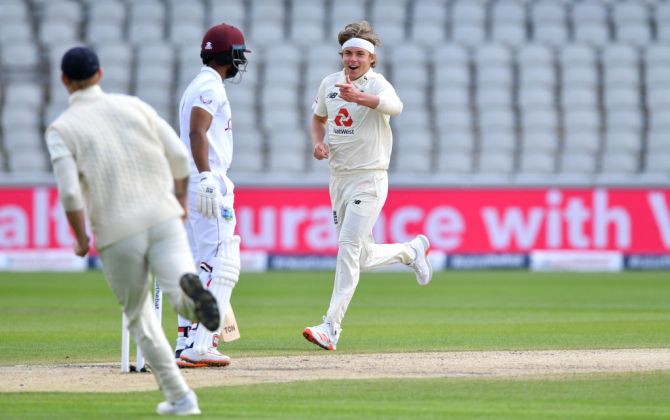 Sam Curran celebrates taking the wicket of Shai Hope