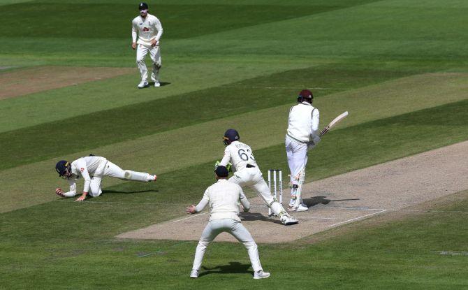 England's Ollie Pope completes a stunning catch to dismiss West Indies' Alzarri Joseph