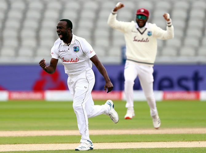 West Indies fast bowler Kemar Roach celebrates after taking the wicket of England opener Dom Sibley on Day 1 of the 3rd Test in Manchester on Friday