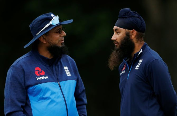 Amar Virdi (right) speaks with England Lions bowling coach Saqlain Mushtaq on June 28, 2017 