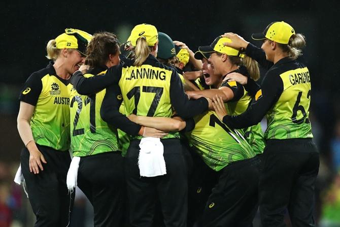 Australia's players celebrate victory over South Africa in the ICC women's T20 World Cup semi-final at the Sydney Cricket Ground on Thursday. 