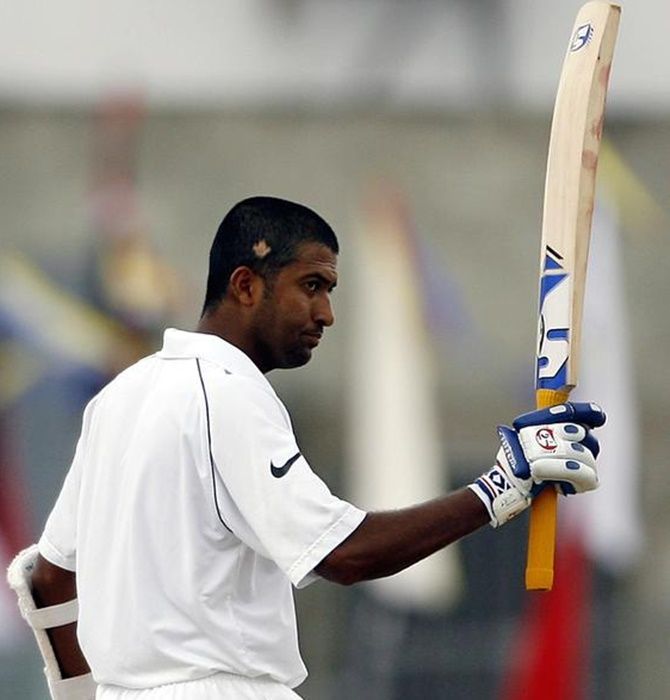 India's Wasim Jaffer celebrates his double century on the fourth day of the first Test against the West Indies, at St. John's, on June 5, 2006. 