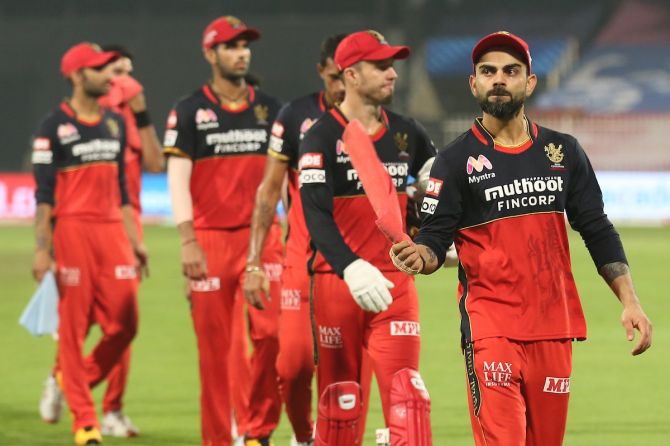 Royal Challengers Bangalore skipper Virat Kohli leads his players off the field after the defeat to SunRisers Hyderabad in the IPL match in Sharjah on Saturday
