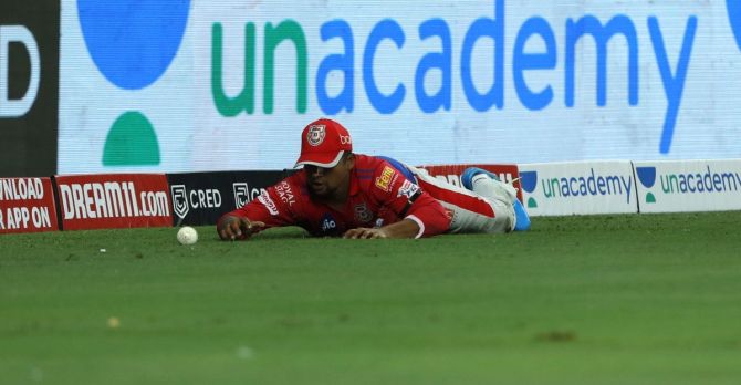 Kings XI Punjab's Sarfaraz Khan fields at the boundary during the match against Royal Challengers Bangalore on September 24, 2020