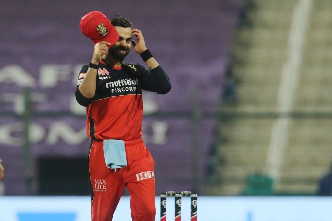 Royal Challengers Bangalore captain Virat Kohli is all smiles after making the play-offs despite losing to Delhi Capitals in the Indian Premier League match in Abu Dhabi on Monday