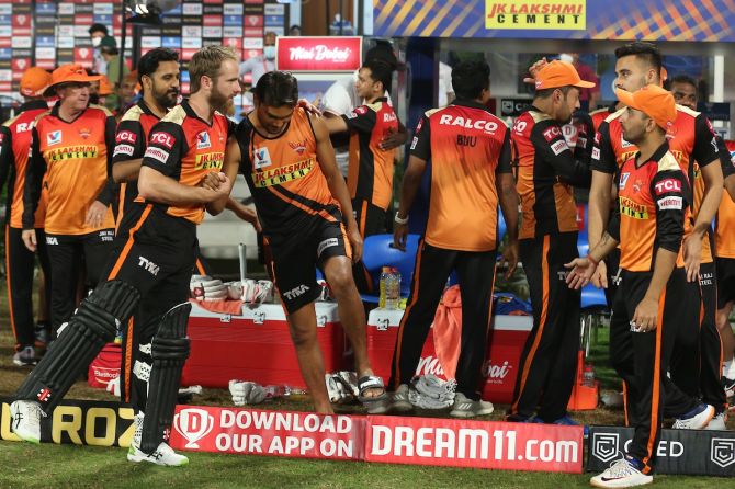 Sunrisers Hyderabad players celebrate after David Warner and Wriddhiman Saha clinch a 10-wicket victory over Mumbai Indians in the IPL match in Sharjah on Tuesday
