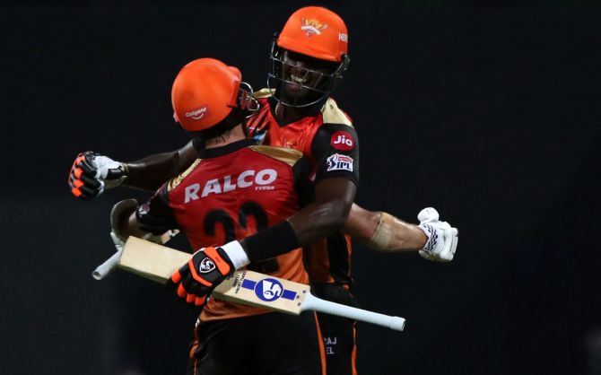 Sunrisers Hyderabad batsmen Jason Holder and Kane Williamson celebrate after clinching victory over Royal Challengers Bangalore in the Indian Premier League Eliminator match in Abu Dhabi on Friday