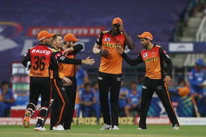 Delhi Capitals players celebrate after Jason Holder, centre, dismissses Shreyas Iyer