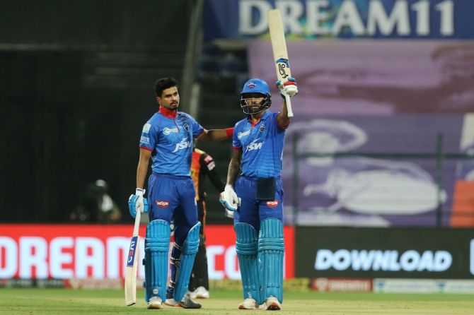 Delhi Capitals opener Shikhar Dhawan gets a pat on the back from skipper Shreyas Iyer after completing his fifty in the IPL Qualifier 2