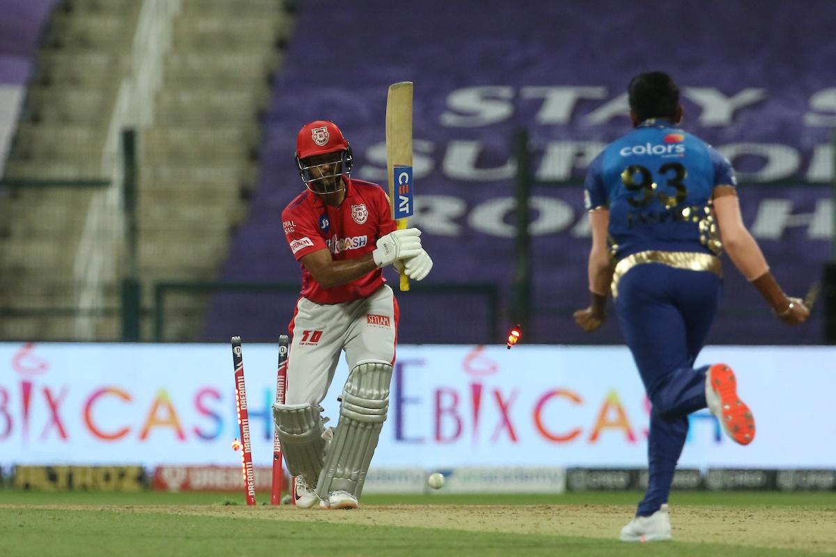 Kings XI opener Mayank Agarwal is bowled by Jasprit Bumrah.