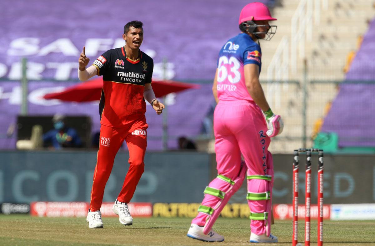 RCB pacer Navdeep Saini celebrates taking the wicket of Jos Buttler