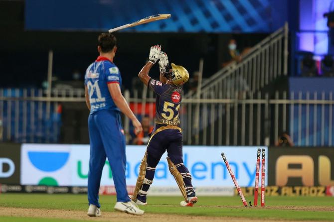 Rahul Tripathi walks back after being bowled by Marcus Stoinis.