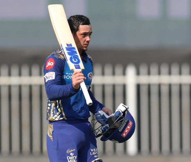 Mumbai Indians opener Quinton de Kock celebrates his fifty against Sunrisers Hyderabad in the IPL match, at the Sharjah Cricket Stadium, on Sunday.