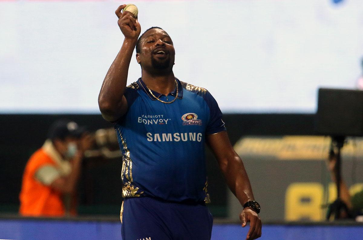 Kieron Pollard celebrates after taking the catch to dismiss Jos Buttler width=