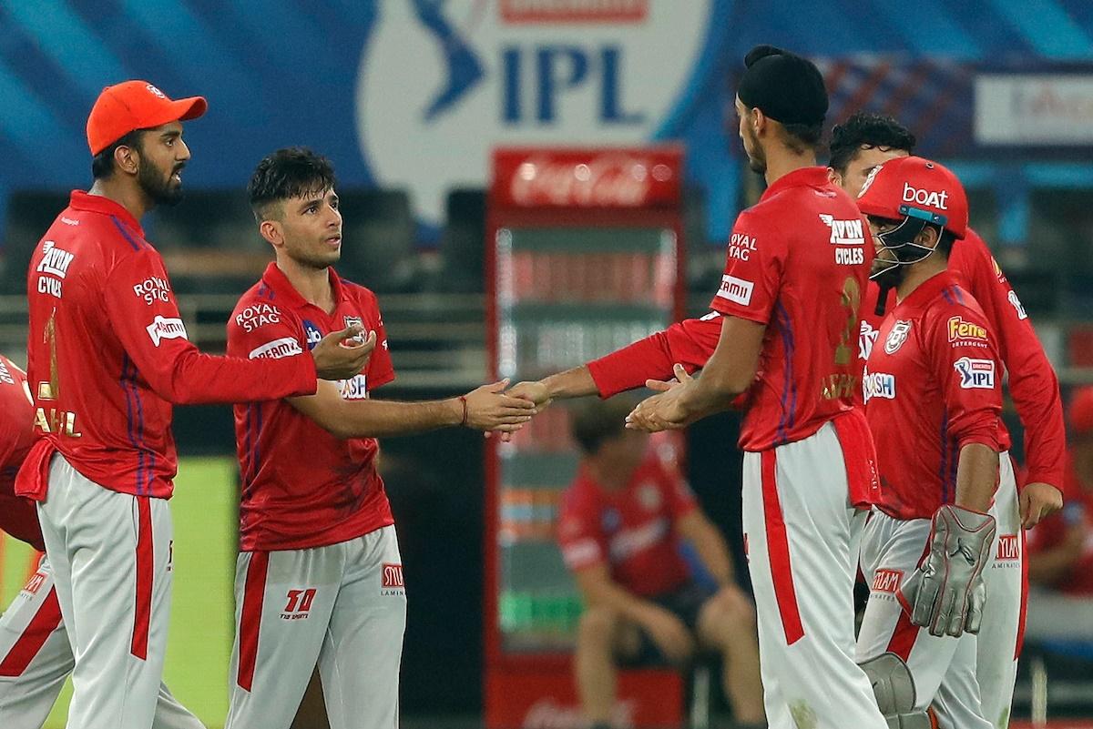 Ravi Bishnoi is congratulated by his Kings XI Punjab teammates after dismissing David Warner.