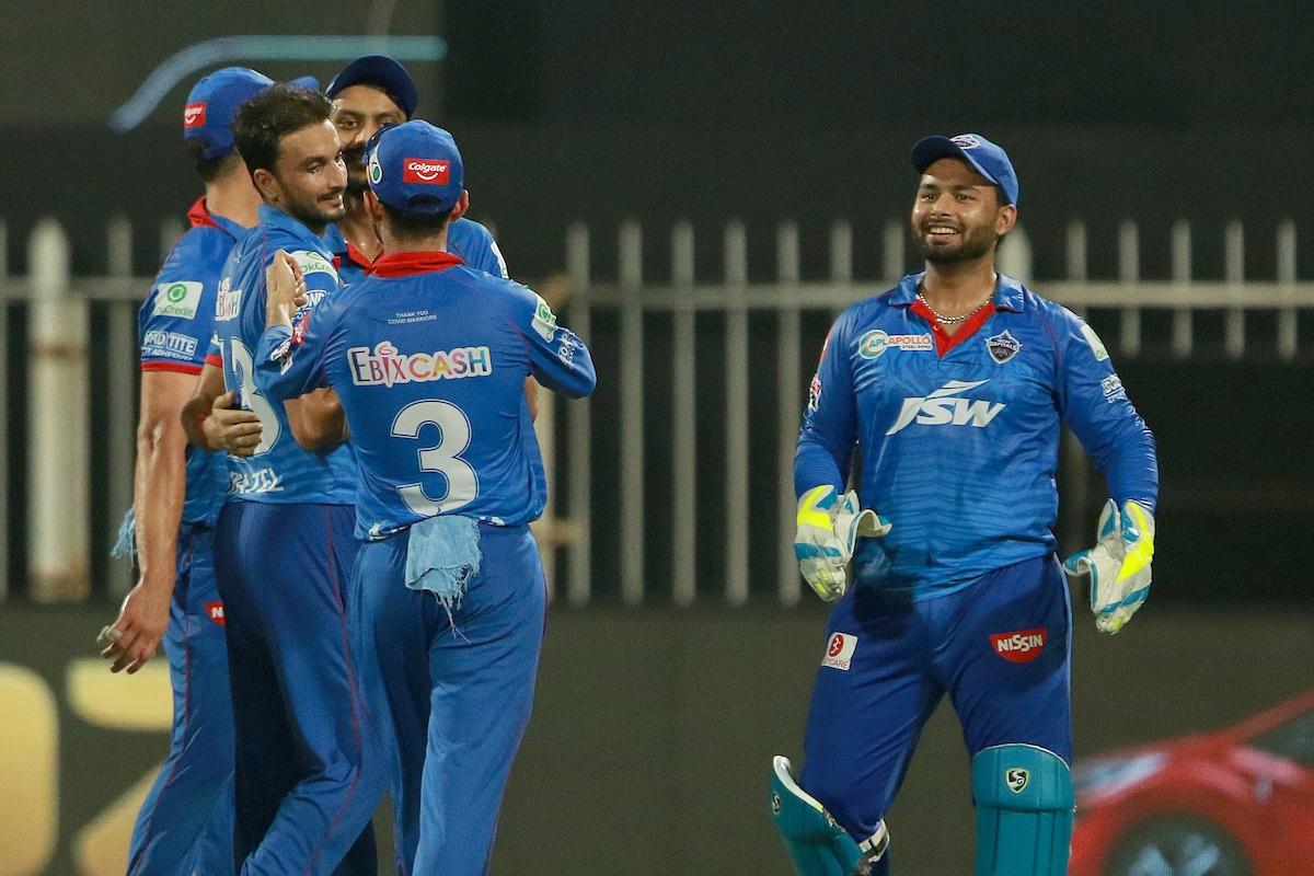 Harshal Patel is congratulated by his Delhi Capitals teammates after dismissing Kolkata Knight Riders batsman Nitish Rana.