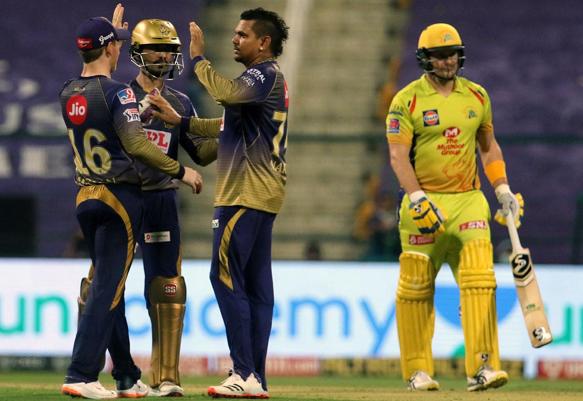 KKR's Eoin Morgan, skipper Dinesh Karthik and Sunil Narine celebrate the dismissal of Shane Watson