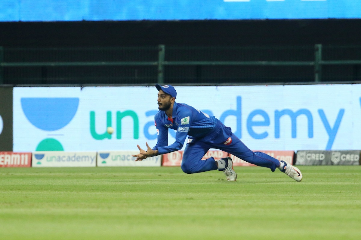 Axar Patel takes the catch to dismiss Ishan Kishan.