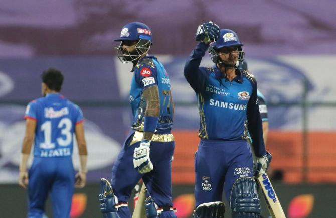 Mumbai Indians' Quinton de Kock (right) and Suryakumar Yadav struck quick half-centuries in the match against Delhi Capitals on Sunday.