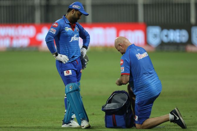 Delhi Capitals' Rishabh Pant gets some medical attention during the Indian Premier League (IPL ) match against Rajasthan Royals at the Sharjah Cricket Stadium, Sharjah on Friday, 9th October