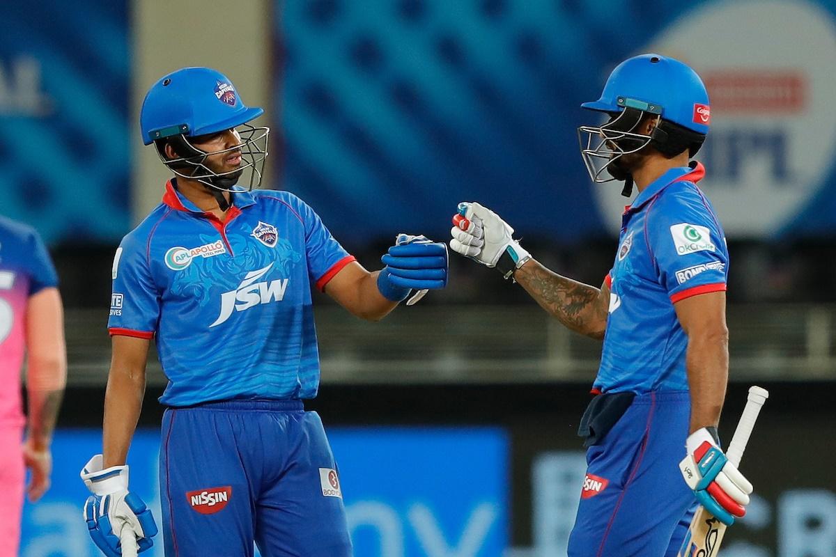 Shikhar Dhawan and Shreyas Iyer celebrate their 50-run partnership.