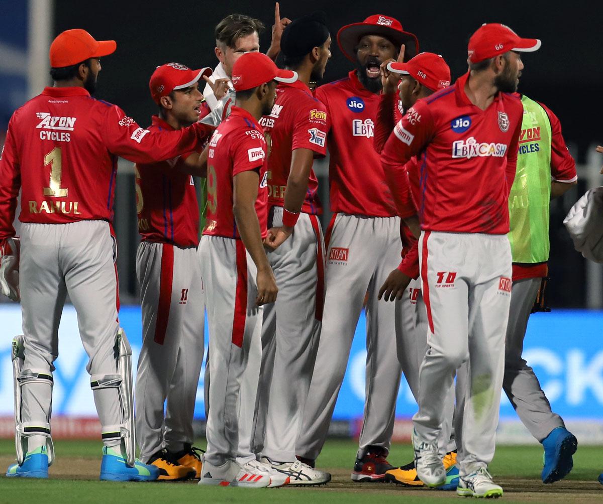 Kings XI Punjab's players celebrate after Arshdeep Singh dismisses Devdutt Padikkal