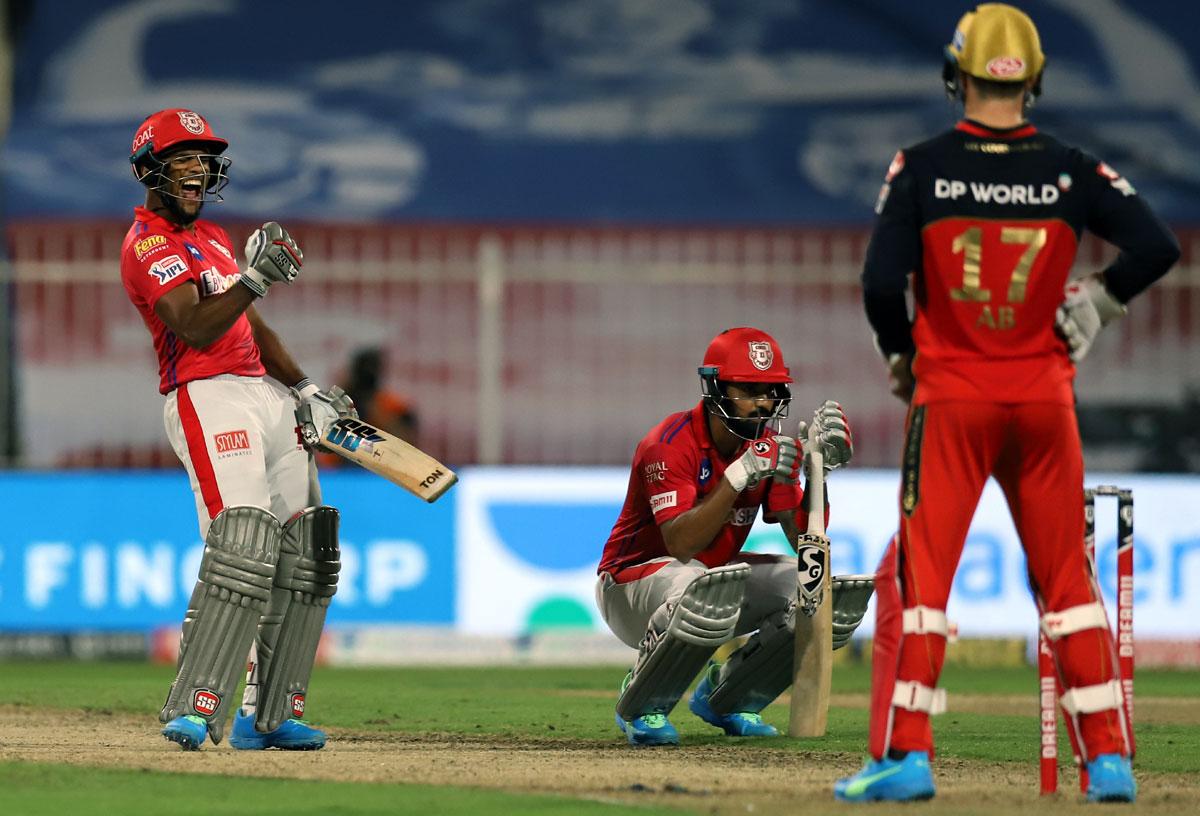 Nicholas Pooran celebrates while KL Rahul looks on as Kings XI win off the last ball