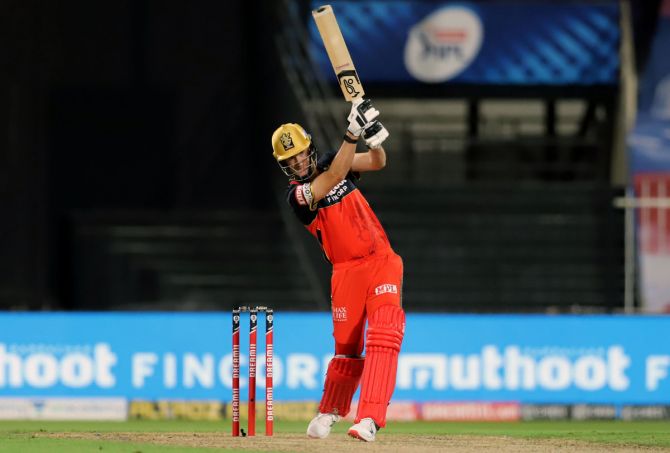 Royal Challengers Bangalore's Chris Morris hits out during the IPL match against Kings XI Punjab, in Sharjah, on Thursday.