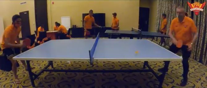 Manish Pandey and Trevor Bayliss face off in a match of table tennis