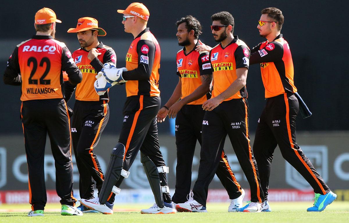 SunRisers Hyderabad players celebrate the wicket of Rahul Tripathi