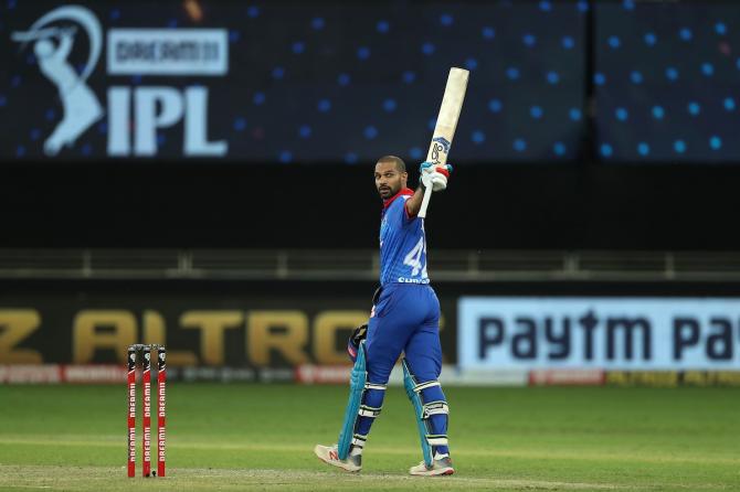 Delhi Capitals opener Shikhar Dhawan celebrates his hundred during the IPL match against Kings XI Punjab in Dubai on Tuesday.