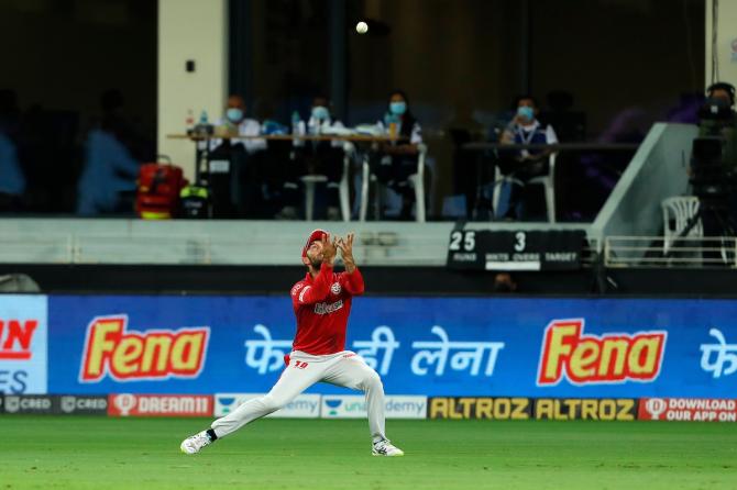 Glenn Maxwell gets under the ball to take the catch of Prithvi Shaw off the bowling of James Neesham 