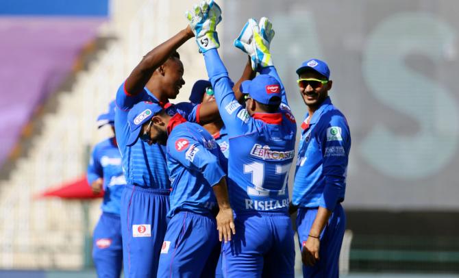 Kagiso Rabada celebrates with his Delhi Capitals teammates after having Dinesh Karthik caught behind by Rishab Pant