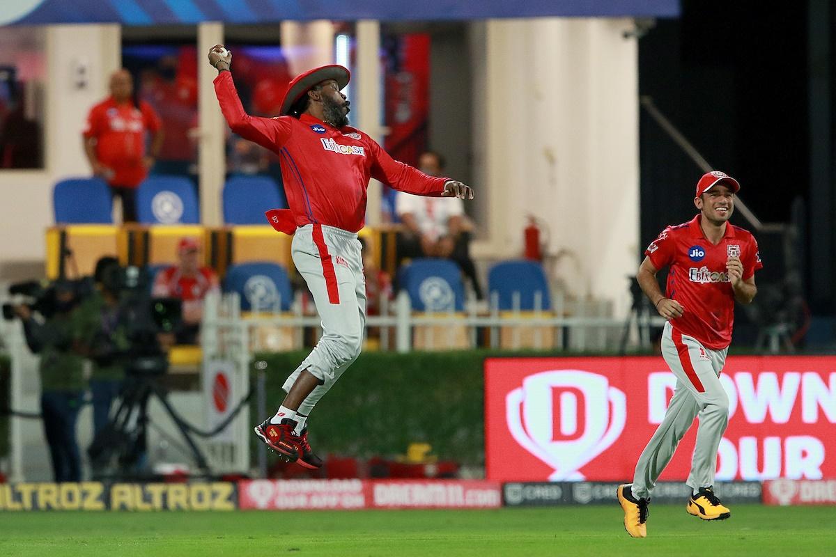 Chris Gayle celebrates after catching Nitish Rana.