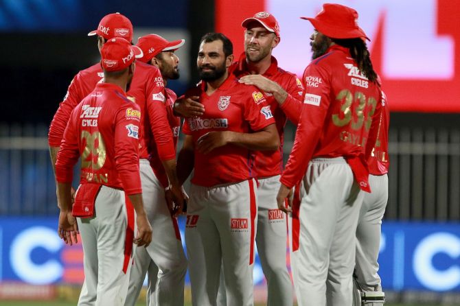 Mohammad Shami is congratulated by his Kings XI Punjab teammates after dismissing Rahul Tripathi.